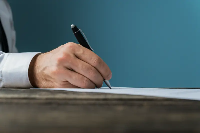 Solicitor reviewing a will with an older couple